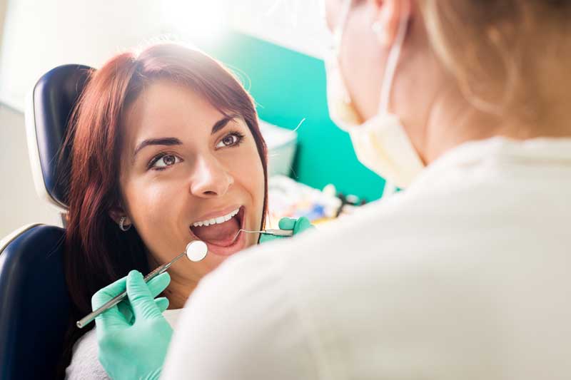 periodontal-disease-diagnosis-and-treatment-banner Dr keri with patient